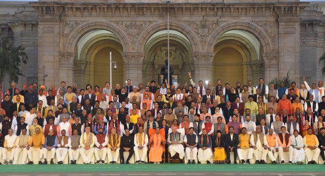 LUCKNOW, INDIA - DECEMBER 16: Uttar Pradesh Chief Minister Yogi Adityanath along with ministers and MLAs from other parties during a group photo session at the end of the winter assembly session of Uttar Pradesh government in front of Vidhan Bhavan on December 16, 2021 in Lucknow, India. (Photo by Deepak Gupta\/Hindustan Times\/Sipa USA
