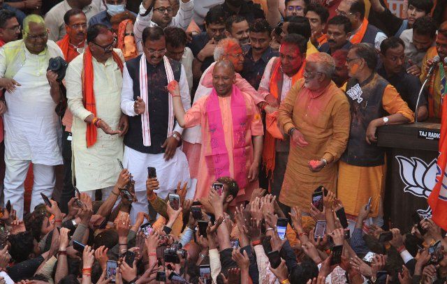 LUCKNOW, INDIA - MARCH 10: UP Chief Minister Yogi Adityanath along with deputy CMs Keshav Prasad Maurya and Dinesh Sharma, BJP State president Swatantra Dev Singh, senior BJP leader Laxmikant Bajpai and others celebrates after Bhartiya Janta Party (BJP) wins the Uttar Pradesh assembly election at BJP state headquarter on March 10, 2022 in Lucknow, India. The Bharatiya Janata Party coalition has won 272 seats and was leading on one, while the Samajwadi Party coalition finished second with 124 seats and was leading on one. (Photo by Deepak Gupta\/Hindustan Times\/Sipa USA