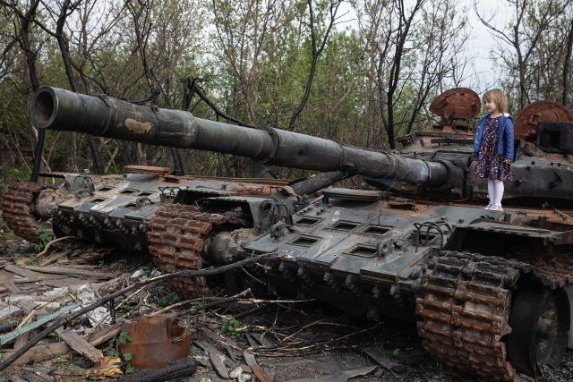 A girl stands on the tower of a destroyed Russian tank near Makariv village, Kyiv region. Russia invaded Ukraine on 24 February 2022, triggering the largest military attack in Europe since World War II. (Photo by Mykhaylo Palinchak \/ SOPA Images\/Sipa USA