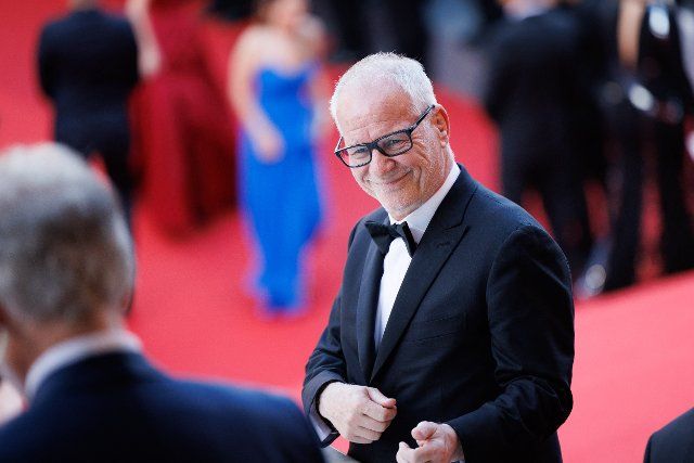Cannes Festival chief Thierry Fremaux plays air guitar on Born To Run of Bruce Springsteen during the screening of "Three Thousand Years Of Longing (Trois Mille Ans A T\