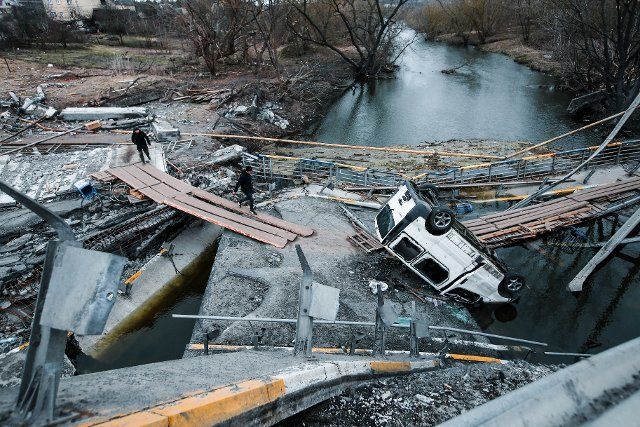 A view of a destroyed van and bridge in Irpin, Ukraine. Irpin is a town located north of Kyiv, heavily attacked and destroyed during the first phase of the war. Russia invaded Ukraine on 24 February 2022, triggering the largest military attack in Europe since World War II. (Photo by Aziz Karimov \/ SOPA Images\/Sipa USA
