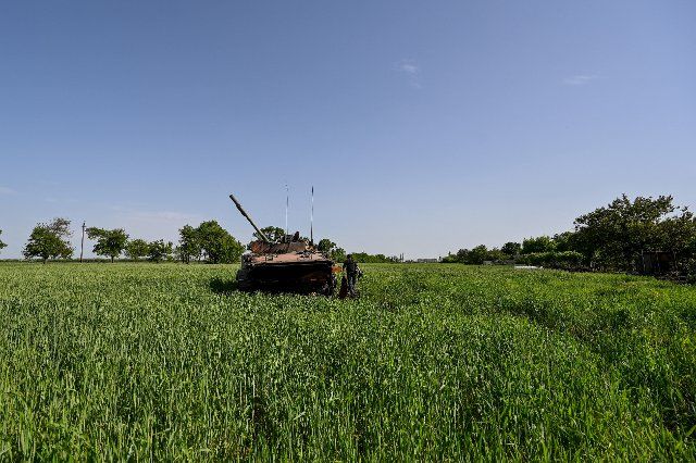 A destroyed Russian military vehicle is pictured in a green field in Novopil, a village liberated from Russian invaders, Donetsk Region, eastern Ukraine, May 31, 2022. Photo by Dmytro Smoliyenko\/Ukrinform\/Abaca\/Sipa