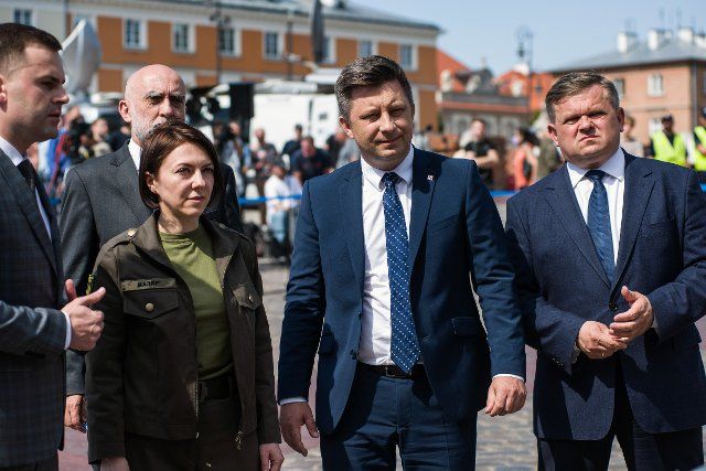 Deputy Minister of Defense of Ukraine, Hanna Maliar (L2) and Michal Dworczyk (R2), Head of the Chancellery of the Prime Minister are seen at the official opening of the exhibition in Warsaw. Polish and Ukrainian officials open an outdoor exhibition at Warsaw\