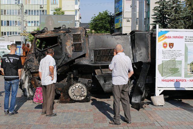 The burned military equipment of the Russian Federation, located on Maidan Nezalezhnosti near the Shevchenko monument and peaceful people walking nearby. (Photo by Viacheslav Onyshchenko \/ SOPA Images\/Sipa USA