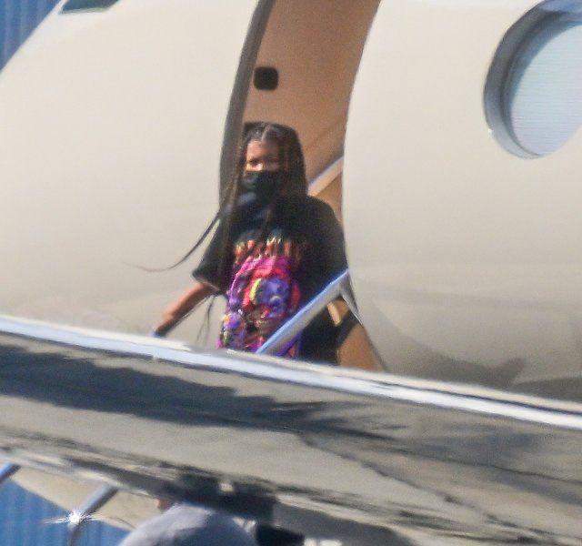 Kim and Khloe Kardashian arrive back in Los Angeles after celebrating Kourtney\