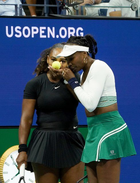 Serena Williams and Venus Williams compete in a doubles match at the 2022 US Open inside Arthur Ashe Stadium at the Billie Jean King Tennis Center in Flushing Meadows Corona Park in Flushing NY on September 1, 2022. Pictured: Serena Williams and 