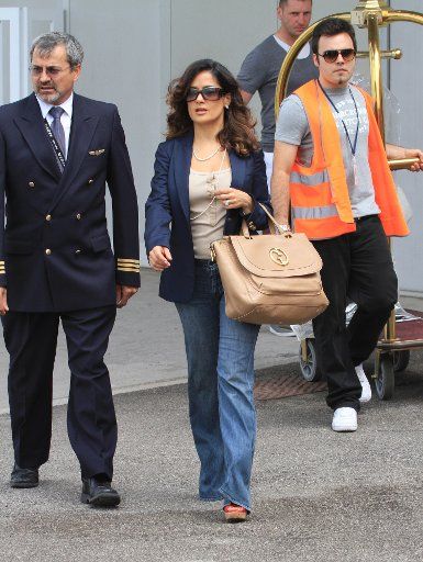 Mexican actress, director and producer Salma Hayek arrives at Marco Polo Airport in Venice, Italy to attend the Palazzo Grassi Art Museum opening.. .Pictured: Salma Hayek. . Ref: SPL283753 010611 .Picture by: Maurizio La Pira \/ Splash News ...