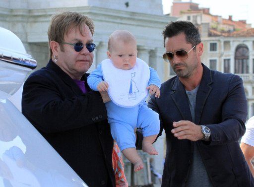 UK popstar Elton John with David Furnish and their son, Zachary, are spotted in Venice, Italy.. .Pictured: Elton John and son, Zachary. . Ref: SPL283876 020611 .Picture by: Maurizio La Pira \/ Splash News . . Splash News and Pictures ...