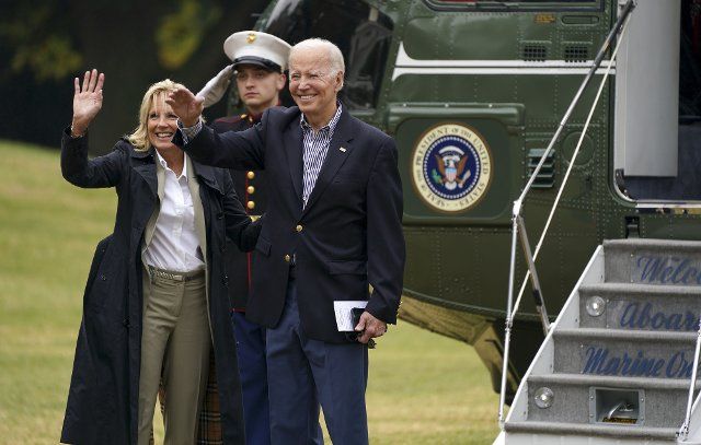 10\/5\/2022 - Washington, District of Columbia, United States of America: United States President Joe Biden and first lady Dr. Jill Biden wave to Latino influencers who are visiting as they depart from the White House in Washington, DC en route to Fort Myers, Florida on Wednesday, October 5, 2022. The President and First Lady will survey storm-ravaged areas and will then receive a briefing on current response and recovery efforts. (Leigh Vogel \/ CNP \/ Polaris