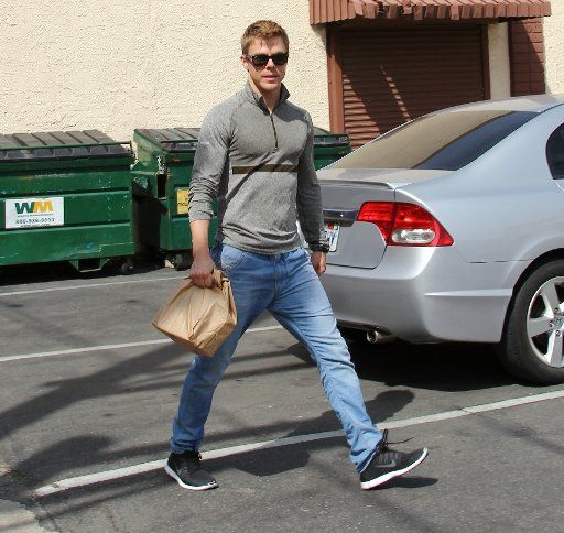 115648, Amy Purdy and partner Derek Hough arrive to begin a long day practice at the DWTS rehearsal studio in Los Angeles. Los Angeles, California - Friday March 28, 2104. Photograph: 