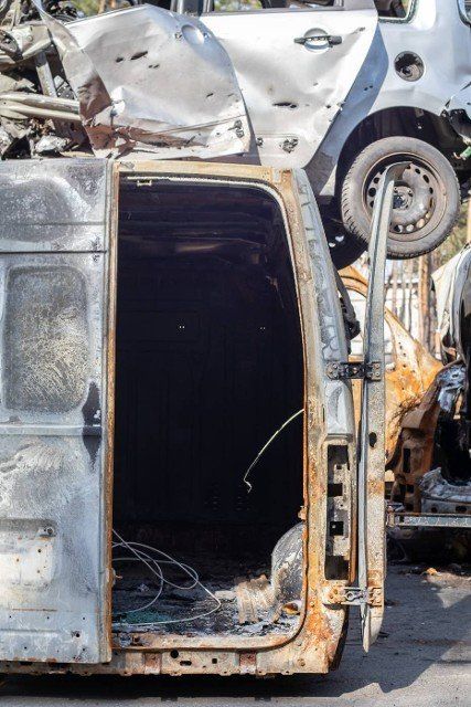 A lot of rusty burnt cars in Irpen,  after being shot by the Russian military. Russia\