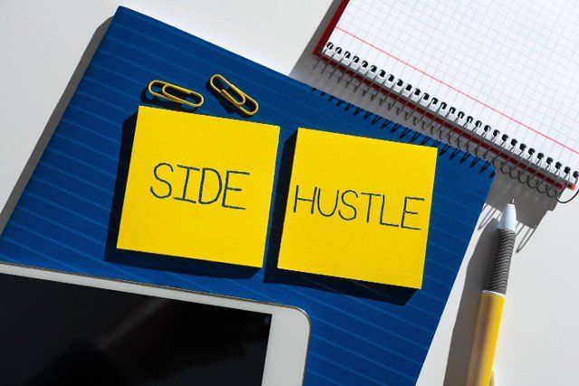 Text sign showing Side Hustle,  Word Written on way make some extra cash that allows you flexibility to pursue Important News Presented On Two Sticky Notes On Desk With Mobile Phone.