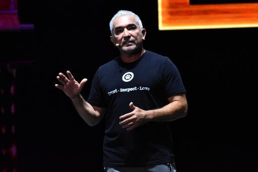 The Dog Trainer Cesar Millan speaks on stage during his show \