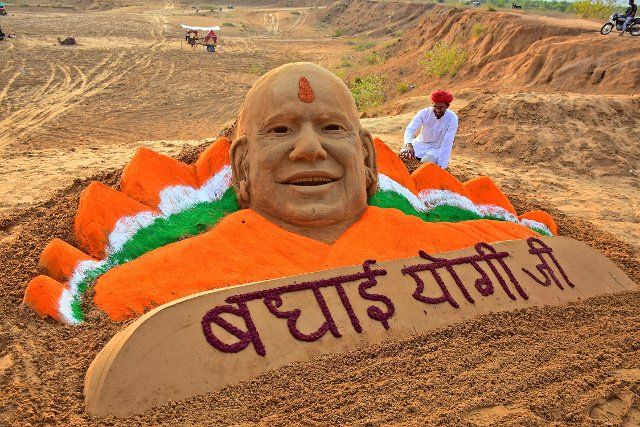 Sand artist Ajay Rawat creates a sculpture of Uttar Pradesh Chief Minister Yogi Adityanath to congratulate him on his victory in UP Assembly polls. Bharatiya Janata Party (BJP) wins in assembly elections of Uttar Pradesh, Uttarakhand, Goa and Manipur state. (Photo by Sumit Saraswat\/Pacific Press