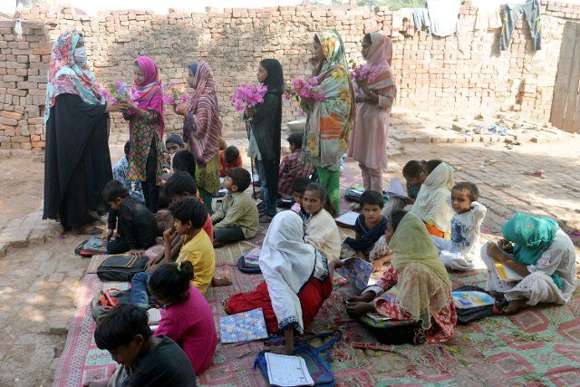 Pakistani teachers of United Social Welfare Society teaching their class (Dissable Students Class) a government funded Non Formal Basic Education School (NFBES) on the eve of World Teachers’ Day at a bricks kiln in the outskirts of Lahore. During the celebration of World Teachers’ Day held annually on October 5 since 1994 which commemorates teachers organizations worldwide. Its aim is to mobilize support for teachers and to ensure that the needs of future generations will continue to be met by teachers. (Photo by Rana Sajid Hussain\/Pacific Press