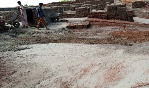 MOHENJO DARO, PAKISTAN, AUG 29: Laborers are draining out accumulated rain water caused damage to the World Heritage monuments in Mohenjo Daro on Saturday, August 29, 2020. (Jamal Dawoodpoto\/PPI Images