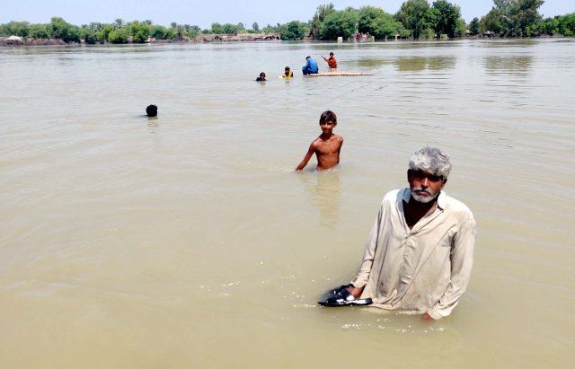 SUKKUR, PAKISTAN, SEP 03: Flood affected people are moving to safe place after submerged into flooded and rainwater, due to poor sewerage system, creating problems for residents, showing negligence of concerned authorities, located on Keti Pir Pagara Village near Sukkur on Saturday, September 03, 2022. (Shahid Ali\/PPI Images