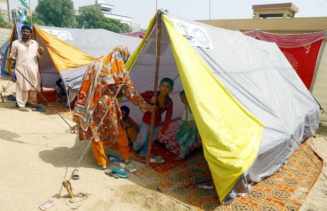 KARACHI, PAKISTAN, SEP 06: Interior Sindh Flood affected people accommodated to rehabilitation at make shift tent houses at a flood affectees relief camp under the supervision of Al-Khidmat Foundation located on Shah Latif Town in Karachi on Tuesday, September 06, 2022. (S.Imran Ali\/PPI Images