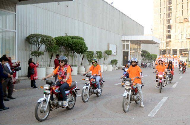 LAHORE, PAKISTAN, DEC 06: Female participants are holding motorcycle rally during Women Mobility and Wow Motorcycle Rally conducting by UNDP in collaboration with the Government of Punjab, held in Lahore on Tuesday, December 06, 2022. (Babar Shah\/PPI Images