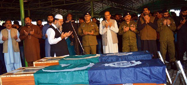 LAHORE, PAKISTAN, DEC 06: Capital City Police Officer (CCPO) Lahore, Ghulam Mahmood Dogar along with others offering funeral prayer of policemen who were martyrs in a firing incident with dacoits, in Lahore on Tuesday, December 06, 2022. (Babar Shah\/PPI Images