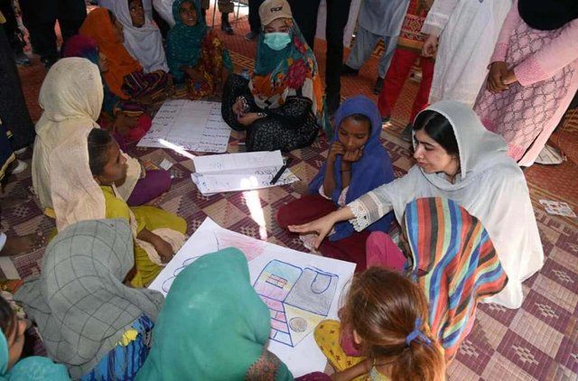 DADU, PAKISTAN, OCT 12: Nobel Laureate, Malala Yousafzai interacts with flood affected people during their visit to flood relief camp at Johi area near Dadu on Wednesday, October 12, 2022. (PPI Images