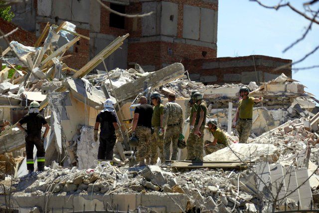 SERHIIVKA, UKRAINE - JULY 1, 2022 - Rescuers remove the rubble and search for people during a response effort to a Russian missile attack on a recreation centre early Friday, June 1, Serhiivka village, Odesa Region, southern Ukraine. This photo 
