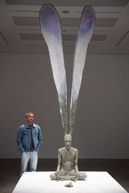 Canadian sculptor David Altmejd poses with his sculpture \
