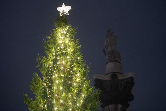 The Trafalgar Square Christmas Tree is lit up. It is a gift from the people of Norway to the people of Britain for the support Britain gave Norway during World War Two, a tradition stretching back to 1947 NS IA now on the 75th anniversary of the 