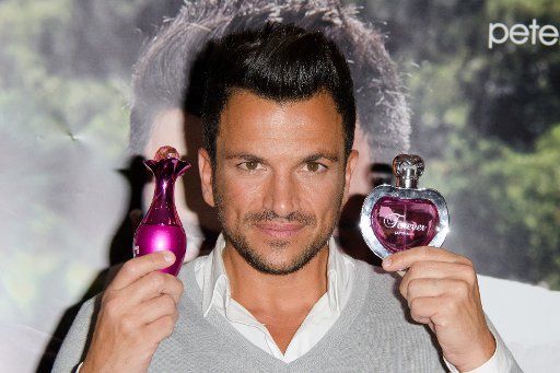 Peter Andre attends a photocall to launch two brand new fragrances for women, Forever and Forever Young at The Perfume Shop, 425 Oxford Street, London. 4th September 2013.