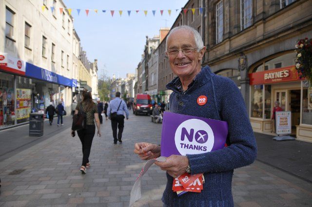 SCOTLAND Perth -- 12 Sep 2014 -- Dave Prentice, 70, a No volunteer campaigner hands out No stickers in the High Street in Perth, Scotland, UK. Campaigning by both camps continues on the last weekend of the Independence Referendum campaign -- Picture 