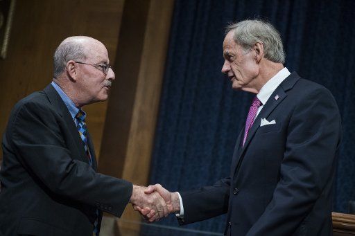 UNITED STATES - AUGUST 02: Ranking Member Tom Carper, D-Del., right, and David Wise of the Government Accountability Office, are seen before a Senate Environment and Public Works Committee hearing in Dirksen Building on the FBI headquarters ...