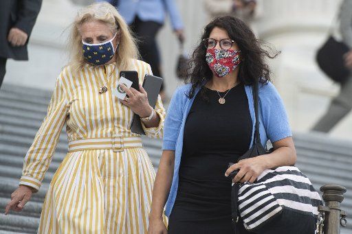 UNITED STATES - AUGUST 22: Reps. Rashida Tlaib, D-Mich., right, and Debbie Dingell, D-Mich., leave the Capitol as the House voted on a bill to ban changes to U.S. Postal Service operations and provide $25 billion in funding on Saturday, August 22, 2020. (Photo By Tom Williams\/CQ Roll Call