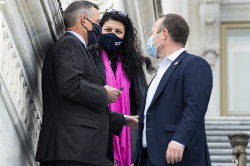 UNITED STATES - DECEMBER 4: From left, Reps. Bruce Westerman, R-Ark., Rashida Tlaib, D-Mich., and Josh Gottheimer, D-N.J., are seen on the House steps of the Capitol during votes on Friday, December 4, 2020. (Photo By Tom Williams\/CQ Roll Call