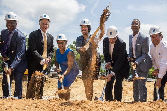 UNITED STATES - JUNE 21: DC Mayor Muriel Bowser, center, Tiffany L., Brown, chairperson of ANC 7B, Vincent Gray, third from right, ward 7 councilman, Kenyan McDuffie, second from right, ward 5 councilman, Gary D. Rappaport, second from left, and others, conduct a ground breaking ceremony on the retail construction phase at Skyland Town Center, Ãthe first town center development in Southeast D.C.,Ã Monday, June 21, 2021. (Photo By Tom Williams\/CQ Roll Call