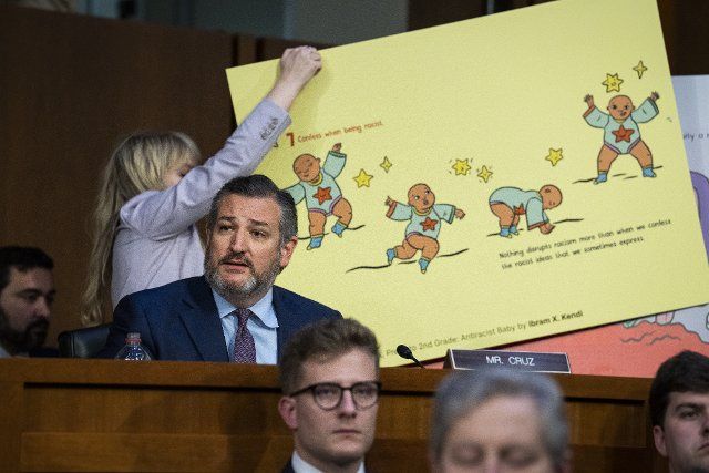 UNITED STATES - MARCH 22: Sen. Ted Cruz, R-Texas, references a page from the childrenÃs book ÃAntiracist Baby,Ã while questioning Judge Ketanji Brown Jackson, President BidenÃs nominee for Associate Justice to the Supreme Court, on the second day of her Senate Judiciary Committee confirmation hearing in Hart Senate Office Building on Capitol Hill, on Tuesday, March 22, 2022. (Tom Williams\/CQ Roll Call