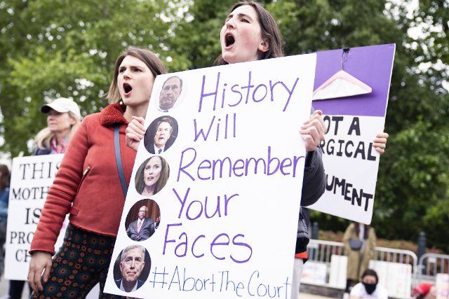 UNITED STATES - MAY 8: Protesters demonstrate outside the U.S. Supreme Court in response to the leaked draft opinion indicating the Court will overturn Roe v. Wade, on Motherâs Day, Sunday, May 8, 2022. (Tom Williams\/CQ Roll Call