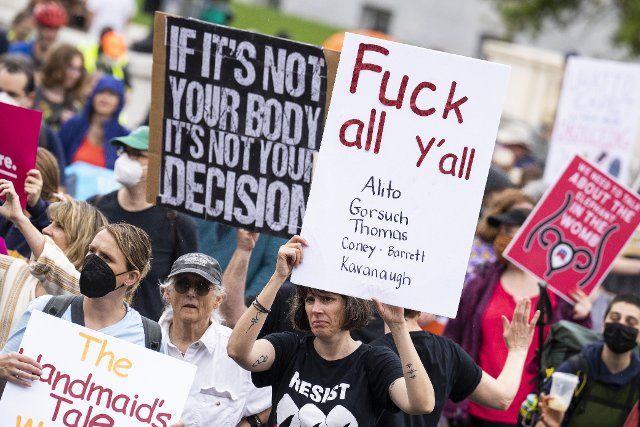 UNITED STATES - MAY 14: Demonstrators are seen at Constitution Avenue and First Street, NE, during a march for abortion rights in response to the Supreme Courtâs leaked draft opinion indicating the Court will overturn Roe v. Wade, on Saturday, May 14, 2022. (Tom Williams\/CQ Roll Call
