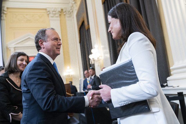 UNITED STATES - JUNE 28: Rep. Adam Schiff, D-Calif., greets Cassidy Hutchinson, an aide to former White House Chief of Staff Mark Meadows, after she testified during the Select Committee to Investigate the January 6th Attack on the United States Capitol hearing to present previously unseen material and hear witness testimony in Cannon Building, on Tuesday, June 28, 2022. (Tom Williams\/CQ Roll Call