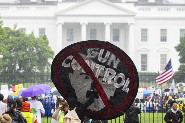 UNITED STATES - JULY 9: A sign in opposition to gun control is seen in Lafayette Square during the Womenâs March to the White House to call on the Biden Administration to protect abortion rights on Saturday, July 9, 2022. (Tom Williams\/CQ Roll Call