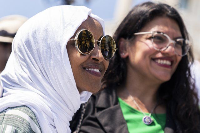 UNITED STATES - JULY 15: Rep. Ilhan Omar, D-Minn., left, and Rep. Rashida Tlaib, D-Mich., attend a rally on the steps of the U.S. Capitol before the House voted on the Womenâs Health Protection Act and the Ensuring Womenâs Right to Reproductive Freedom Act, on Friday, July 15, 2022. (Tom Williams\/CQ Roll Call
