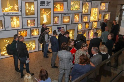 ST PETERSBURG, RUSSIA - OCTOBER 22, 2019: Visitors view an exhibition of TASS archive photographs documenting the history of Soviet\/Russian theatre from 1948 to the present day, at Mariinsky Theatre; titled "Main Shots: Theatre", the exhibition is a ...