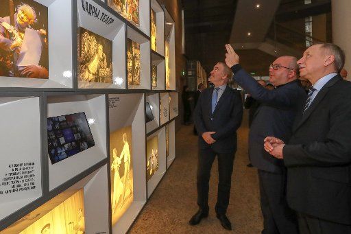 ST PETERSBURG, RUSSIA - OCTOBER 22, 2019: St Petersburg Governor Alexander Beglov (R front), TASS Director General Sergei Mikhailov (2nd R), and the Artistic Director of Mariinsky Theatre Valery Gergiev view an exhibition of TASS archive photographs ...