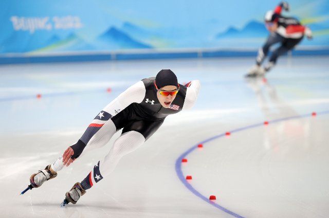 BEIJING, CHINA - FEBRUARY 18, 2022: Athletes Jordan Stolz (L) of the US and Kim Min-seok of South Korea compete in the men\