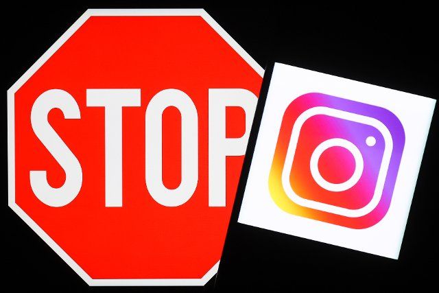 NOVOSIBIRSK, RUSSIA â MARCH 11, 2022: Pictured in this photo illustration is the logo of the Instagram social networking service and a stop sign. The Russian Federal Service for Supervision of Communications, Information Technology and Mass Media 