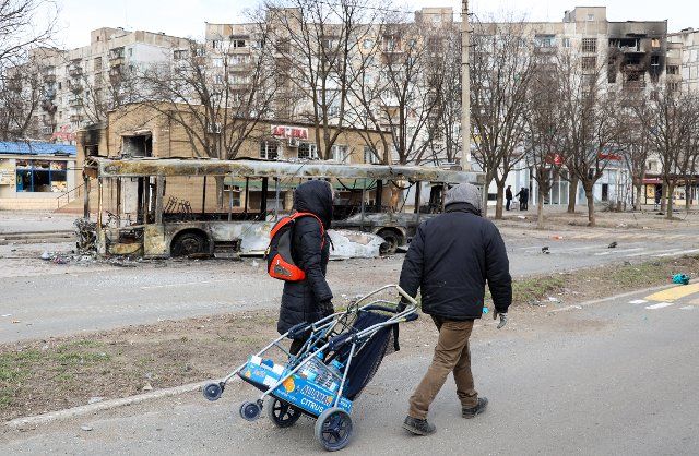 MARIUPOL, UKRAINE - MARCH 29, 2022: Local people are seen in a street in the city of Mariupol. Tension began to escalate in Donbass in February 2022, The Russian Armed Forces are conducting a special military operation in Ukraine following requests 