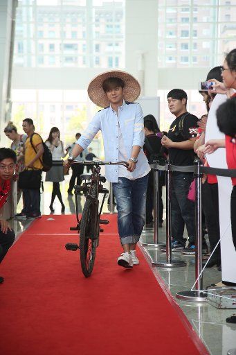 Taiwanese singer and actor Show Lo poses for photograph during a promotional event for Taiwan-style box lunches in Taipei,China on Wednesday May 28,2014.
