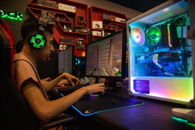 Gamers play and enjoy prebuilt configurations for the game Valorant made by manufacturer Asrock during the fourth day of the SOFA (Salon del Ocio y la Fantasia) 2021, a fair aimed to the geek audience in Colombia that mixes Cosplay, gaming, 