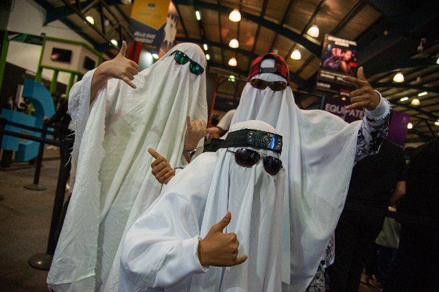 A group of friends dressed as Ghosts during the fourth day of the SOFA (Salon del Ocio y la Fantasia) 2021, a fair aimed to the geek audience in Colombia that mixes Cosplay, gaming, superhero and movie fans from across Colombia, in Bogota, Colombia 