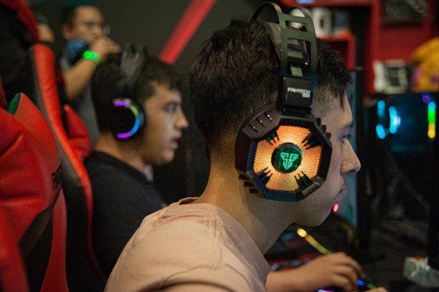 Gamers play and enjoy prebuilt configurations for the game Valorant made by manufacturer Asrock during the fourth day of the SOFA (Salon del Ocio y la Fantasia) 2021, a fair aimed to the geek audience in Colombia that mixes Cosplay, gaming, 