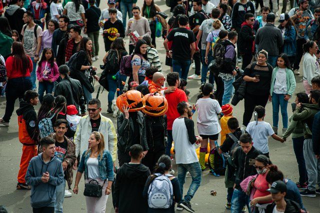 A couple wearing pumpkin masks during the 2022 edition of the SOFA (Salon del Ocio y la Fantasia) in Bogota, Colombia, through October 14 to 18
